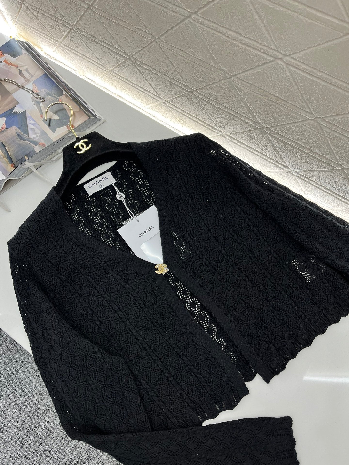 Single-button hollow knitted cardigan