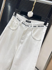 White jeans with logo on waist